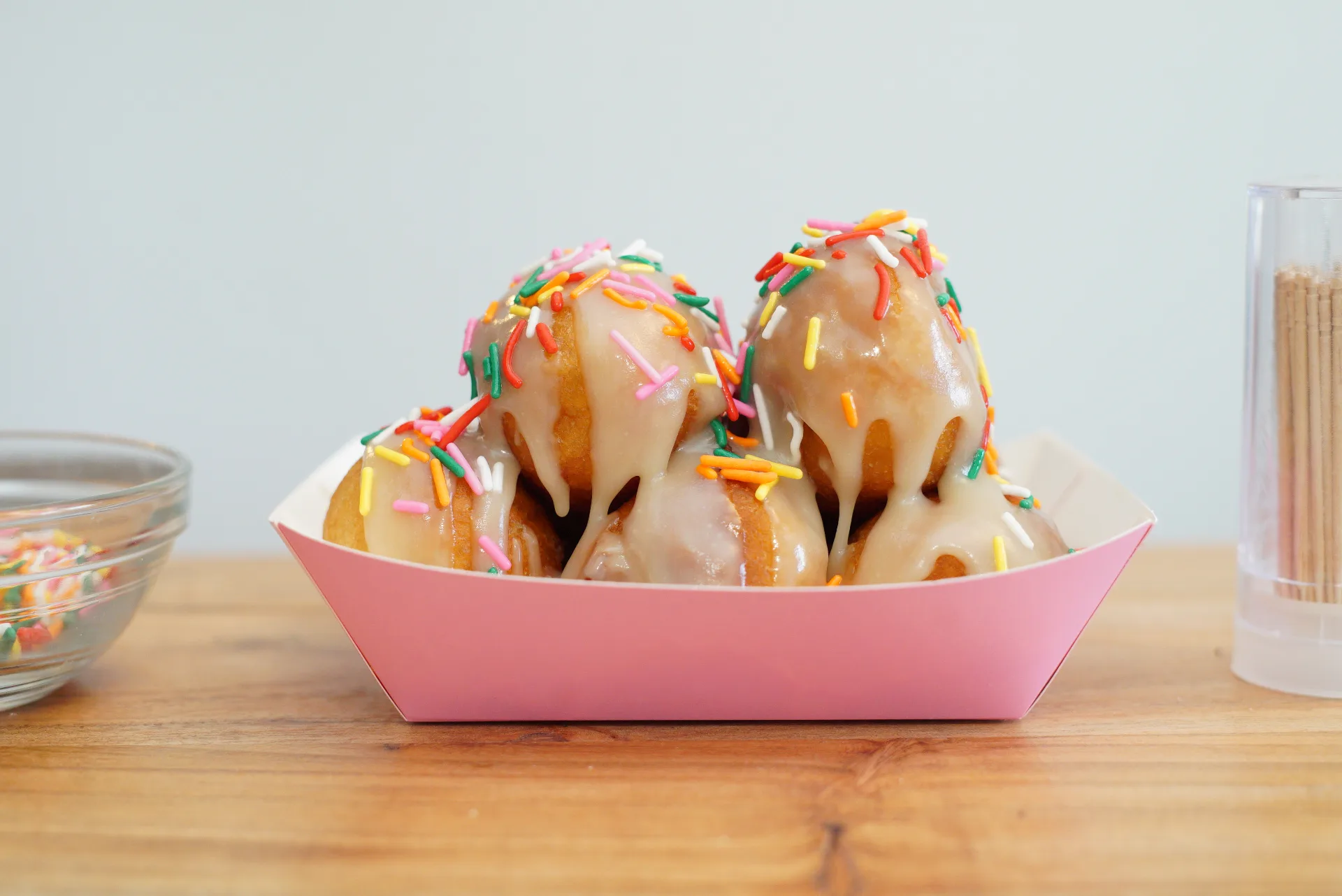 Birthday Cake Puff Puffs with colorful sprinkles and glaze